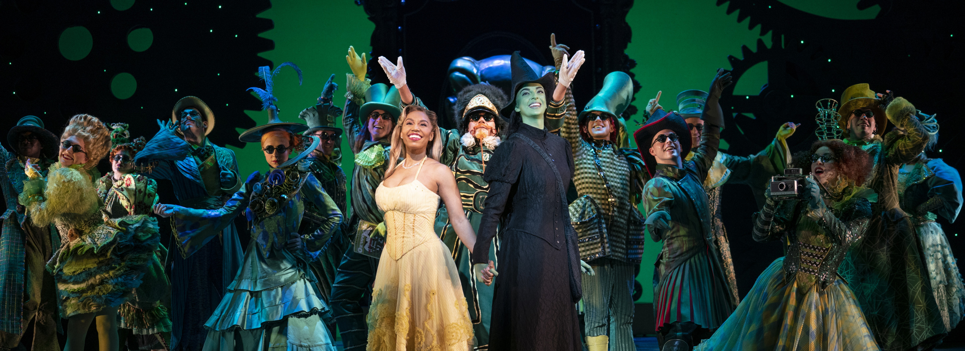 The entire cast of Wicked, the Broadway Musical, singing towards the audience during performance